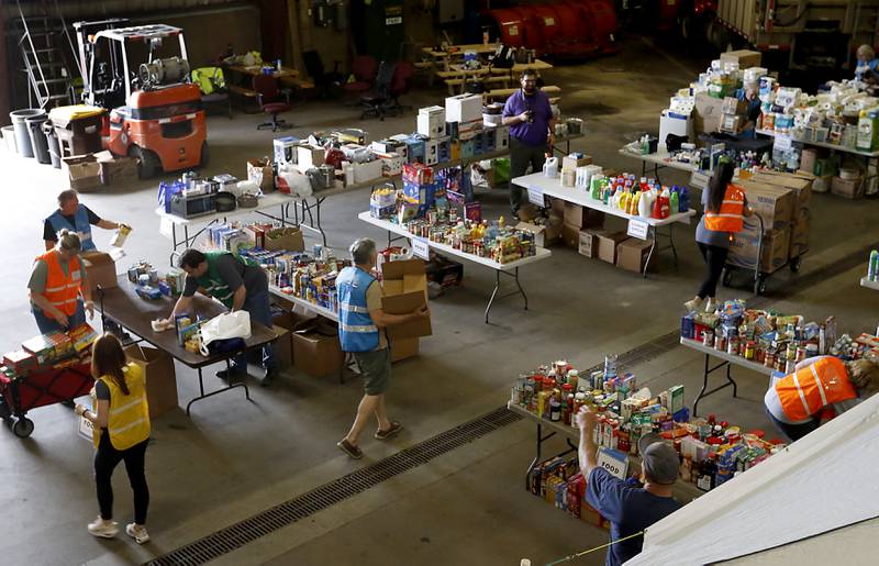 McHenry County Department of Health staff and volunteers from the McHenry County Medical Reserve Corp sort items during the Operation Dropbox Exercise on Tuesday , June 11, 2024, at the McHenry County Division of Transportation near Woodstock. The training exercise simulates the process of unloading and distributing medical counter-measures during emergencies along with helping to sort and distribute the donated items to veterans and their families in the county.