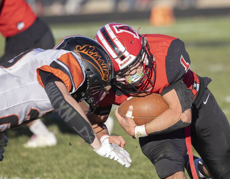 Milledgeville’s Jayden Promenschenkel meets Amboy’s Jose Lopez for the stop Saturday, Nov. 15, 2025, in the 8-man football semifinal.