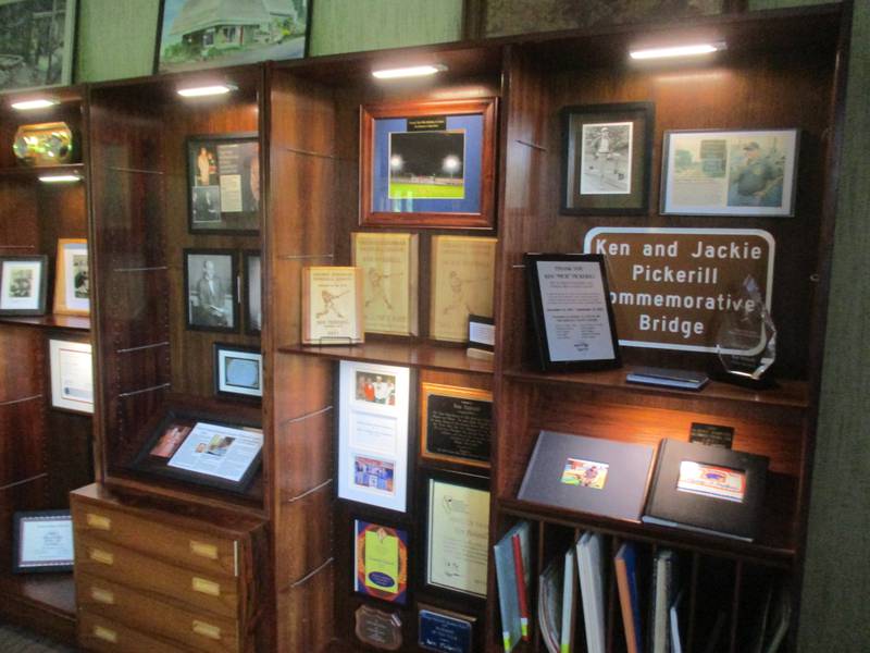 This display pays tribute to the lives of the late Ken and Jackie Pickerill. It is located inside their home, now a Kendall County Forest Preserve events center, which was dedicated on July 15, 2023.