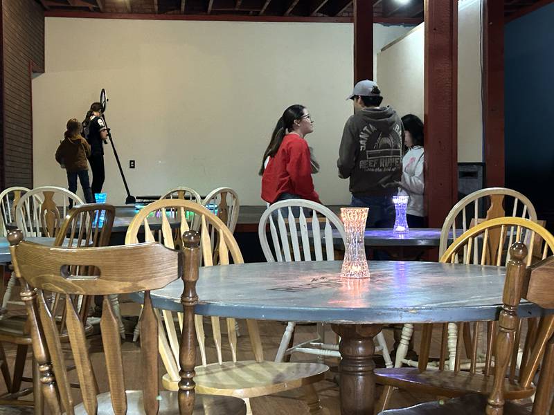 Kids talk while others try out the 360-degree phone booth at the After Teen Lounge informational open house on Sunday, Feb. 22, 2026.