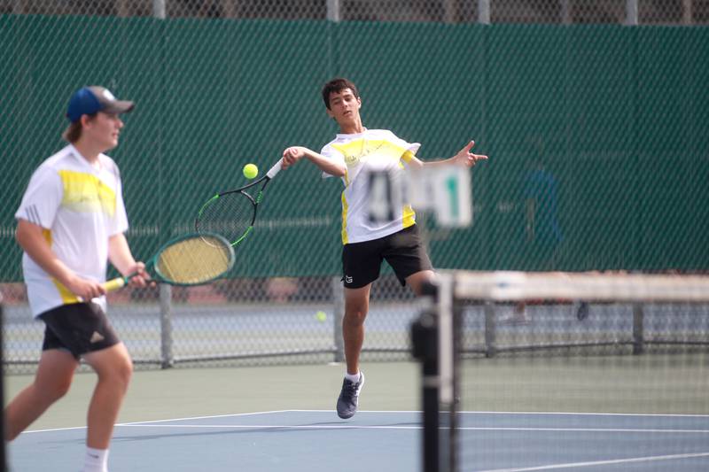 Jacobs’ Jack Soto returns the ball during the first round of the 2A boys state tennis meet with doubles partner Augie Nelson (left) on Thursday, May 29. 2025 at Hersey High School.