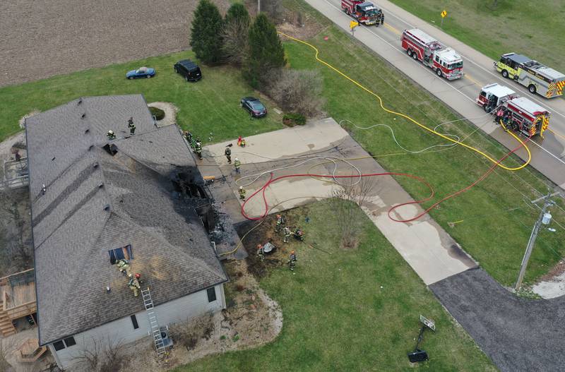 Firefighters work the scene of a structure fire in the 600 block of U.S. Route 6 on Tuesday, April 1, 2025 in La Salle. Fire departments from Peru, La Salle, Utica, Troy Grove, Wallace, Spring Valley and Oglesby were dispatched just before 2:30 to a one-story duplex home.