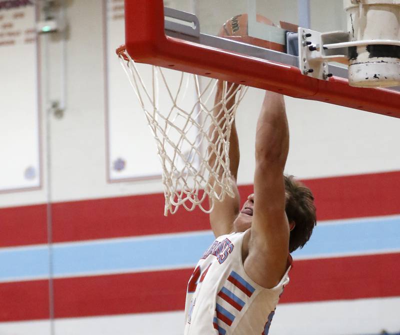 Marian Central’s Christian Bentancur dunks the basketball as he scores his 2,000 career point during a nononference boys basketball game against Marengo on Tuesday, Feb.13, 2024, at Marian Central High School.