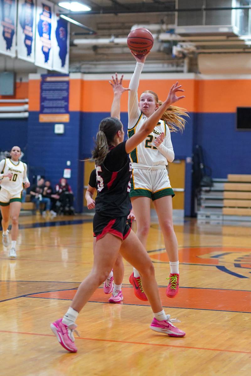 Waubonsie Valley's Lily Newton (23) shoots a floater in the paint against Benet during a Class 4A Oswego Sectional final basketball game at Oswego High School on Thursday, Feb 22, 2024.