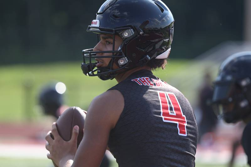 Bolingbrook freshman quarterback Jonas Williams looks to pass at the Morris 7 on 7 scrimmage. Tuesday, July 19, 2022 in Morris.