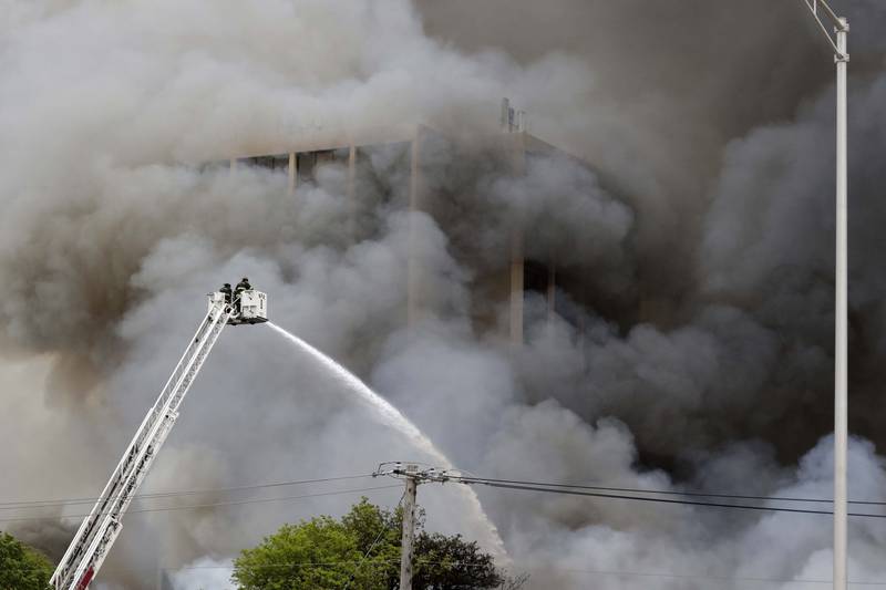Smoke billows upward as firefighters battle a blaze at Pheasant Run Resort on Saturday in St. Charles.