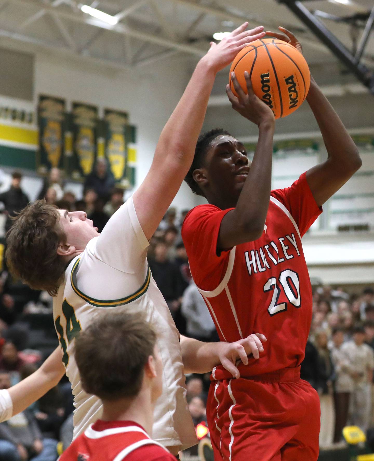 Crystal Lake South's Johnathan Morgan tries to block the shot of Huntley's Isaiah Onu during a Fox Valley Conference boys basketball game on Friday, Jan. 30, 2026, at Crystal Lake South High School.