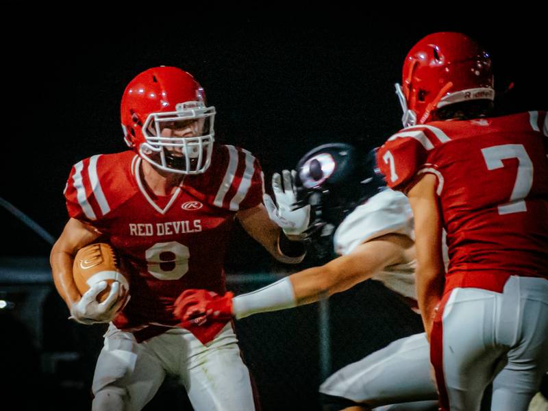 Braden Curran of Hall pushes away Orion player on Friday, August 30, 2024 at Richard Nesti Stadium in Spring Valley.
