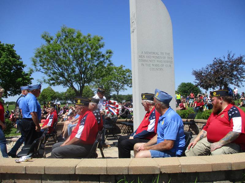 One of three wreaths laid at the Memorial Day ceremony in Plainfield on Monday is brought to the Forever Monument, which was moved to Settlers' Park from its previous location on Route 59. May 25, 2026