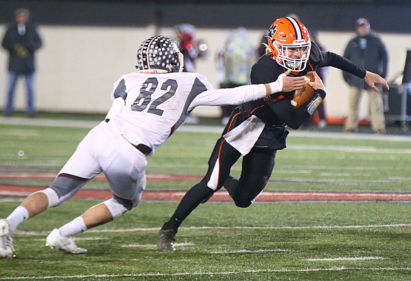 Byron's quarterback Braden Smith, (3) runs with the ball as Tolono's Austin Langendorf, (82) defends during the Class 3A state title game at Huskie Stadium on Friday Nov. 26, 2021 in Dekalb.