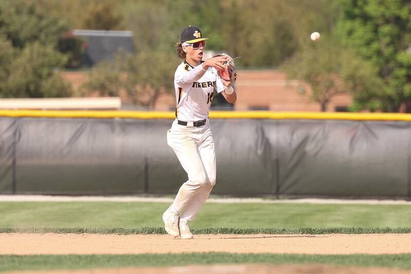Joliet West’s Parker Schwarting throws to first for the out against Joliet Central on Tuesday, May 9, 2023 in Joliet.