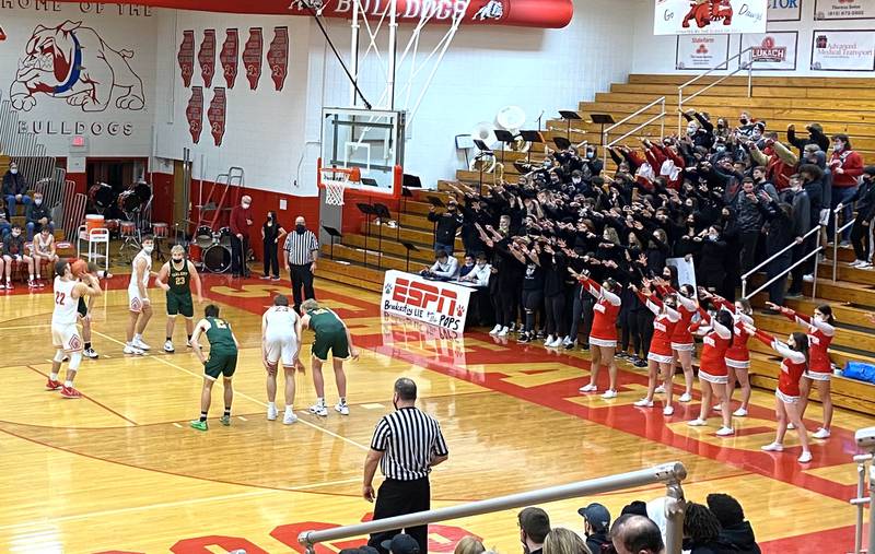Streator's Christian Benning (22) readies a third-quarter free throw attempt in front of the Bulldogs Superfans on Friday, Jan. 28, 2022, at Pops Dale Gymnasium.