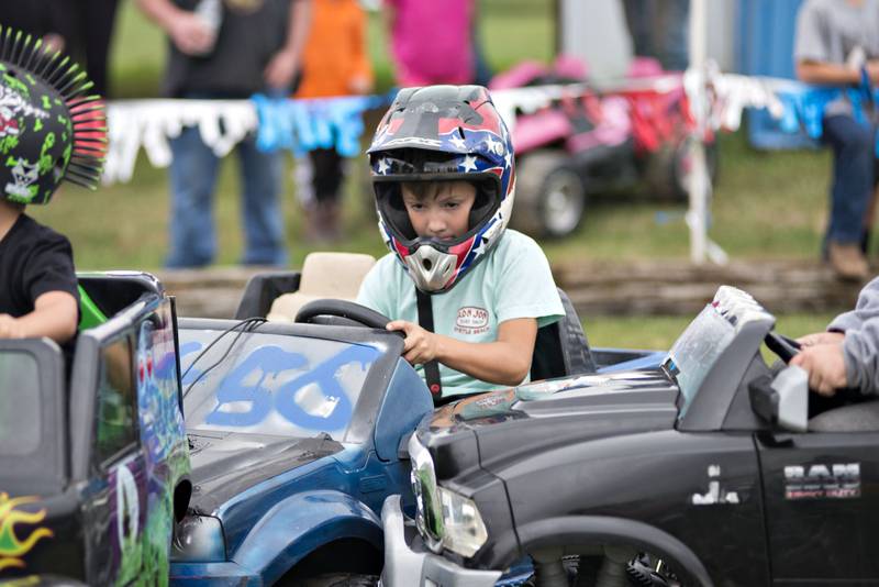 Chase Fortune, 6, of Sterling works the steering wheel while smashing into his fellow drivers Saturday.