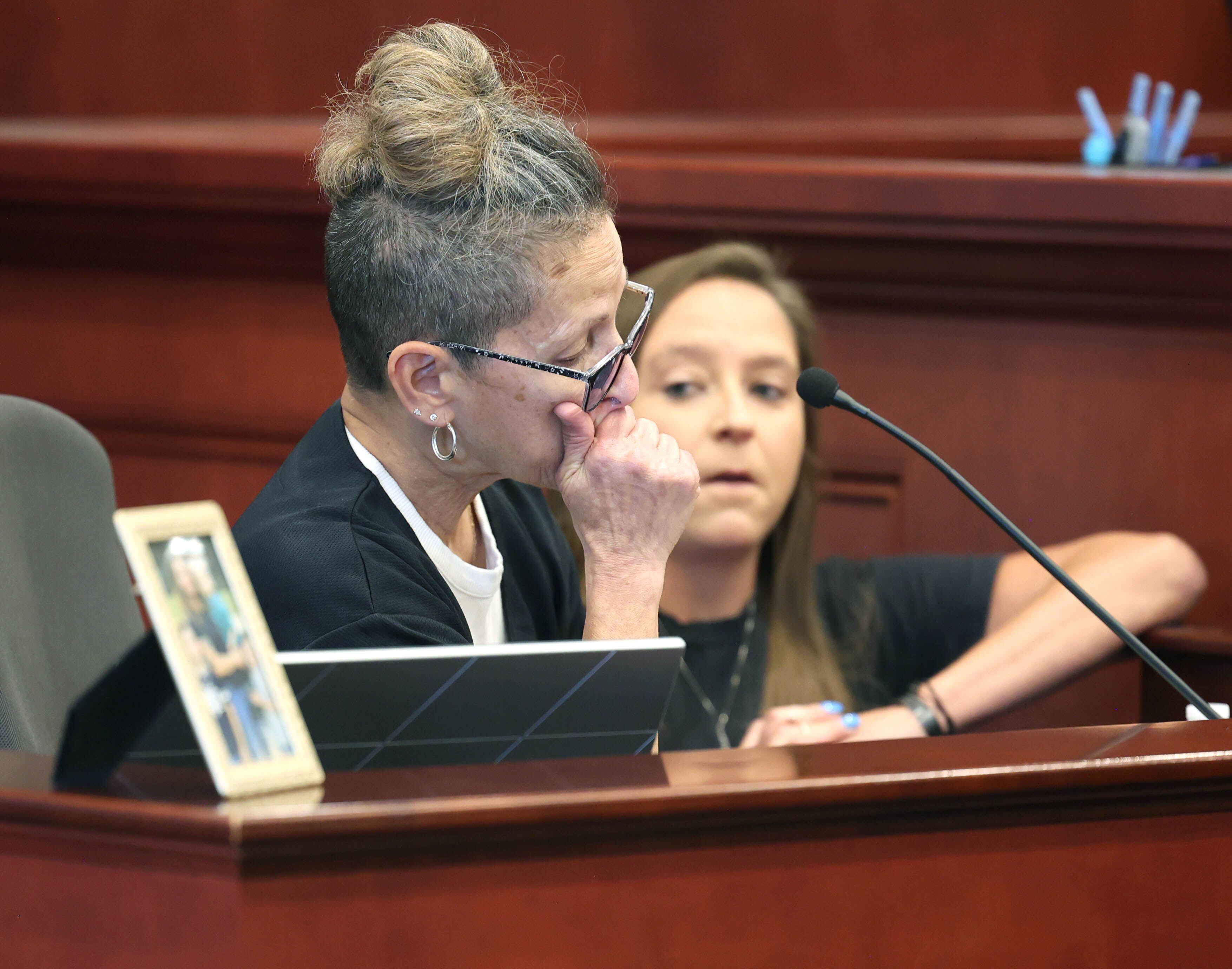 Diane Caporaso, mother of Christina Musil, weeps as she gives her victims impact statement Tuesday, Aug. 26, 2025, during the sentencing hearing for Nathan P. Sweeney at the DeKalb County Courthouse in Sycamore. Sweeney received 14 years in prison for driving under the influence and causing the 2024 crash that killed sheriff’s deputy, veteran and mother Musil.