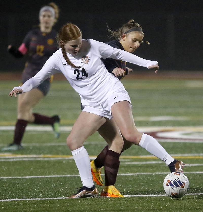 McHenry's Ava Micklinghoff tries to control the ball in front of Richmond-Burton's Alexa Anderson during a non-conference girls soccer match Thursday, March 16, 2023, at Richmond-Burton High. McHenry defeated Richmond Burton 4-0, in the first game of the season for both teams.
