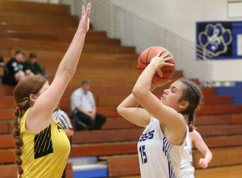 Princeton's Olivia Mattingly looks to shoot as Putnam County's Maggie Spratt defends during the Princeton Holiday Girls Basketball Tournament on Tuesday, Nov. 19, 2024 at Princeton High School.