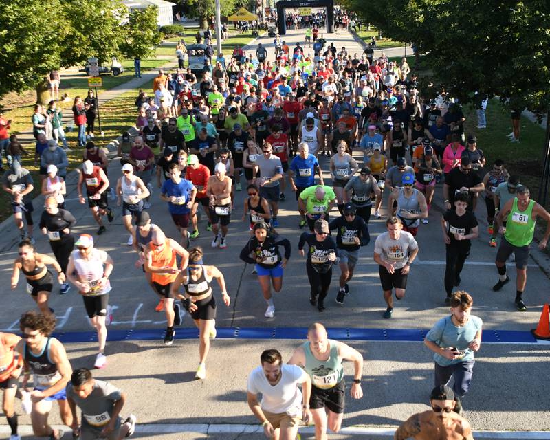 DeKalb Corn Classic 10K racers take off during the start of the race on Sunday, Sept. 29, 2024, held in downtown DeKalb.