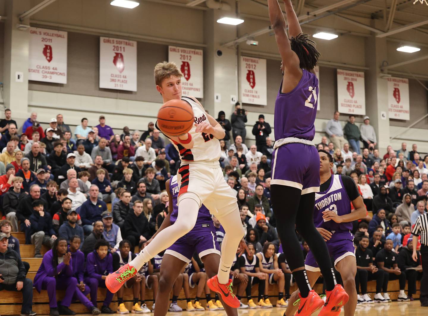 Benet’s Gabriel Sularski (25) starts a pass around the Thorton defense during the When Sides Collide Shootout on Saturday, Jan. 20, 2024 in Lisle, IL.