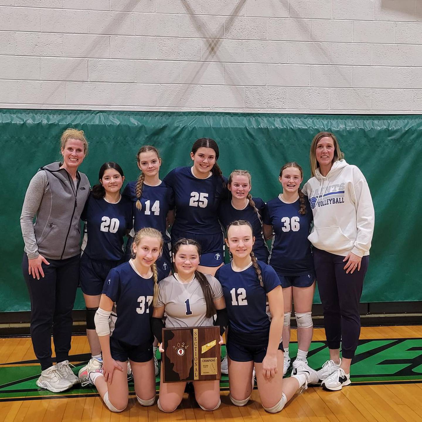 The Trinity Catholic eighth grade volleyball team qualified for the IESA Class 1A state tournament. Team members are Mary SImonetta, Hailey O'Hare, Payden Kelly, Hanna Waszkowiak, Allie Inman, Sofia Sarabia, Lily Tielebein, and Aubrey Urbanski. The team is coached by Laura Urbanski, Tara Duncan and Liz Gryzbowski.