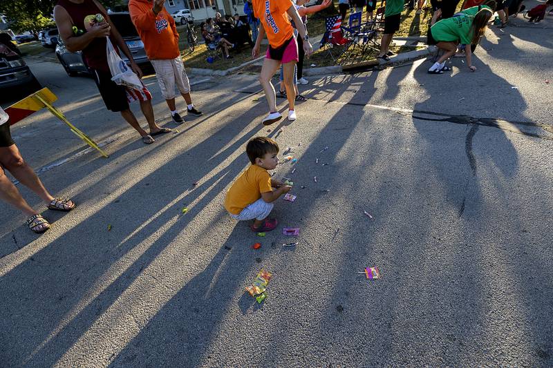 Finn Davis, 2, grabs up candy Thursday, Sept. 25, 2025, during the Rock Falls homecoming parade.