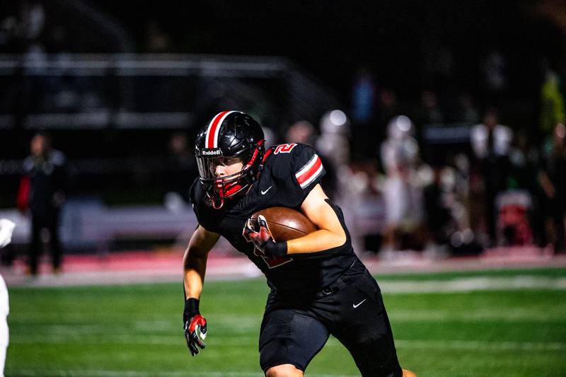 Lincoln-Way Central's Luke Tingley runs a play during a game against Providence on Friday Sept. 5, 2025 at Lincoln-Way Central High School in New Lenox