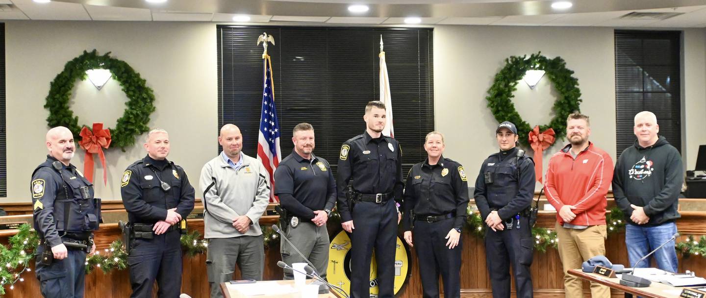 Members of the Peru Police Department came to support new Officer Casey Wood as he was sworn in during Monday night's city council meeting.