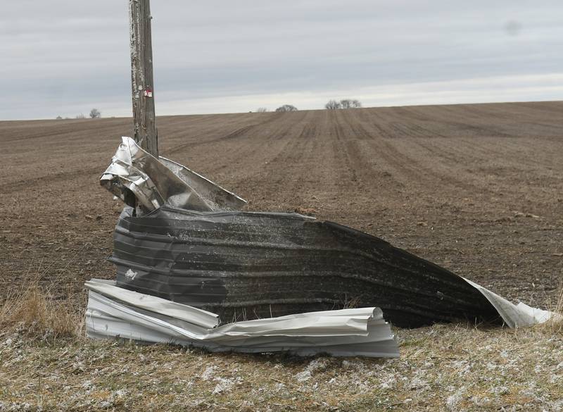 Friday's storm ripped the metal sides from the Gempeler's machine wrapping it around this pole several 100 yards from their home along Illinois 72 northwest of Forreston.