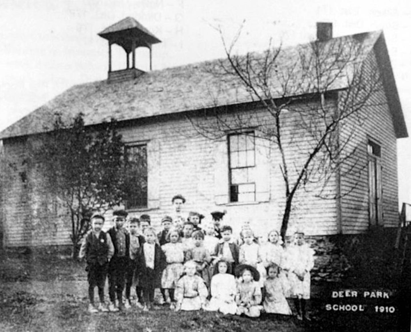 Students who attended Deer Park's one-room schoolhouse in La Salle County stand outside for a photo in 1910.