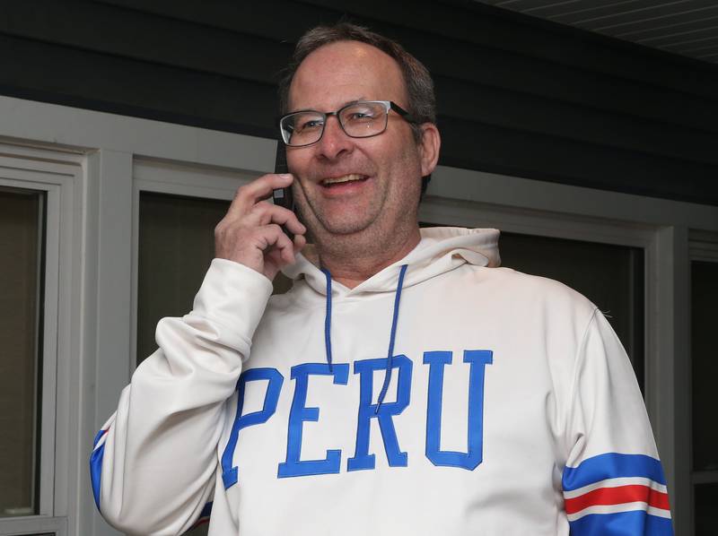 Peru mayor Ken Kolowski smiles while chatting on his phone during Election night on Tuesday, April 1, 2025 at his home in Peru.