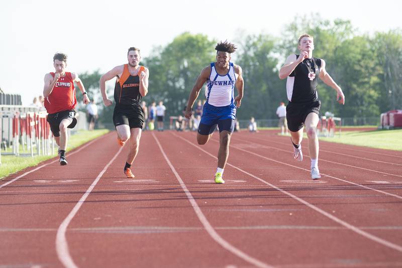 Amboy's Zane Murphy (left), Milledgeville's Gage Wilk and Newman's Marcus Williams and Colton Oleson cross the finish in the 100 dash and at the class 1A Erie track sectionals on Thursday, May 19, 2022.