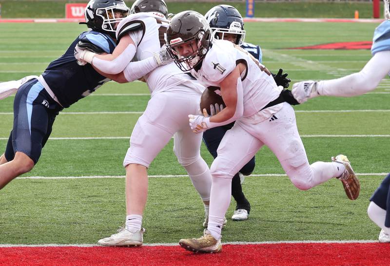Joliet Catholic's Keegan Farnaus finds a hole in the Nazareth defense and scores a touchdown Saturday, Nov. 25, 2023, during their IHSA Class 5A state championship game in Hancock Stadium at Illinois State University in Normal.