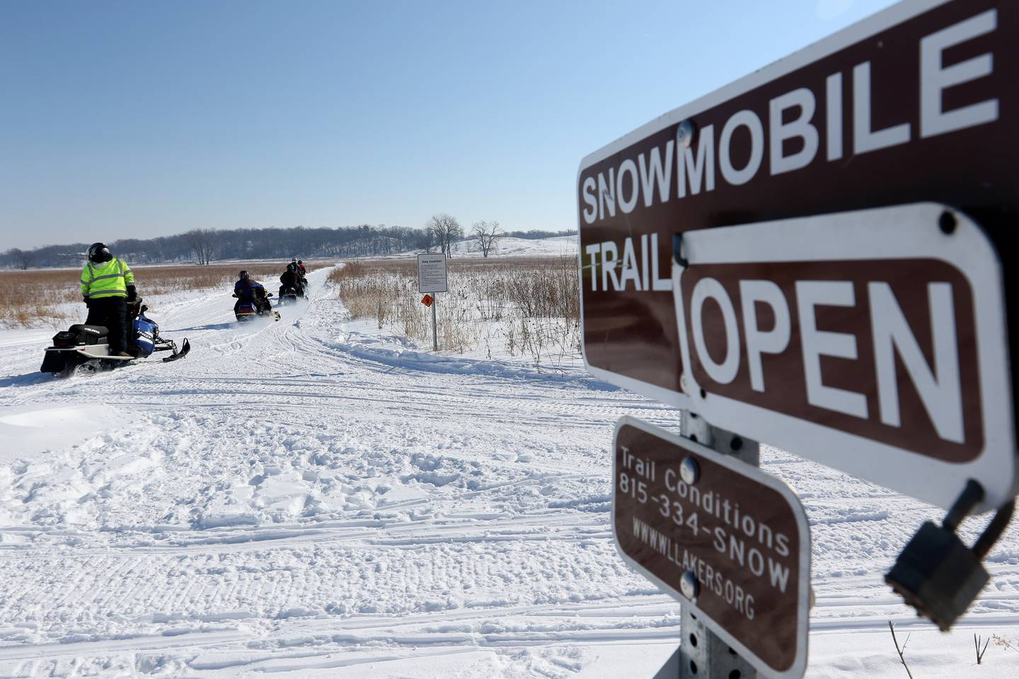 Members of the McHenry County Snowmobile Association leave the snowmobile trail entrance at Glacier Park for a ride through the compacted snow on Saturday, Feb. 20, 2021 in Richmond.  Approximately 25 members participated in the ride.