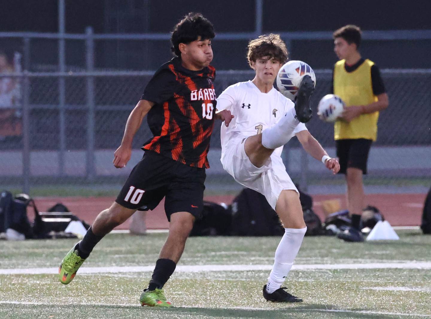 Sycamore's Noah Daykin tries to kick the ball away from DeKalb's Matais Gutierrez during their game Thursday, Oct. 10, 2024, at DeKalb High School.
