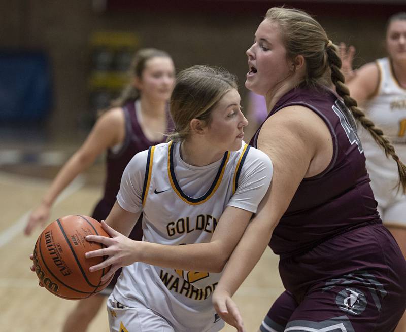 Sterling’s Olivia Melcher looks to pass while being defended by IVC’s Gabi Bramer Monday, Nov. 14, 2022.