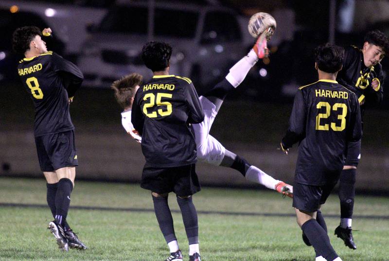 Harvard’s defense closes in as Richmond-Burton’s Joe Kyes bicycle kicks the ball for a goal in varsity soccer on Monday, Oct. 7, 2024, at Dan Horne Field on the campus of Harvard High School in Harvard.