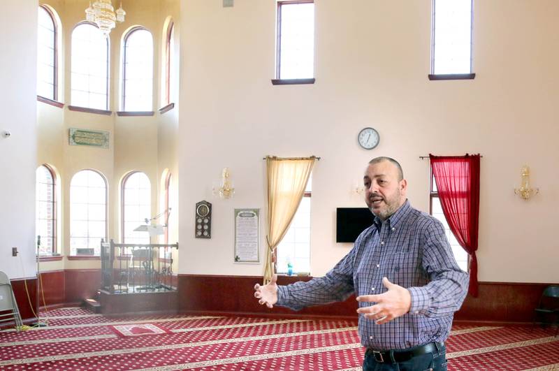 Two men read the Koran Friday, April 7, 2023, in the prayer hall, or musallā, at the Islamic Center of DeKalb. Muslims are currently observing the holy month of Ramadan.