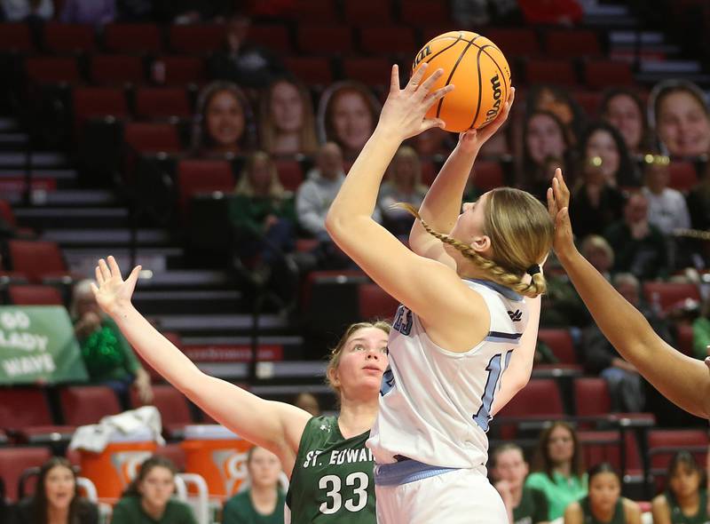 Cissna Park's Sophie Duis shoots a jump shot over St. Edward's Maggie Jarzemsky during the Class 1A third place game on Friday, March 7, 2025 at CEFCU Arena in Normal.