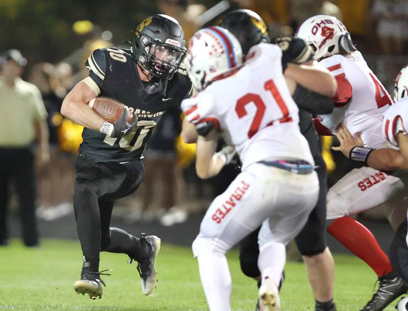 Sycamore's Zack Crawford tries to get outside of Ottawa's Garrett Cupples during their game Friday, Sept. 16, 2022, at Sycamore High School.