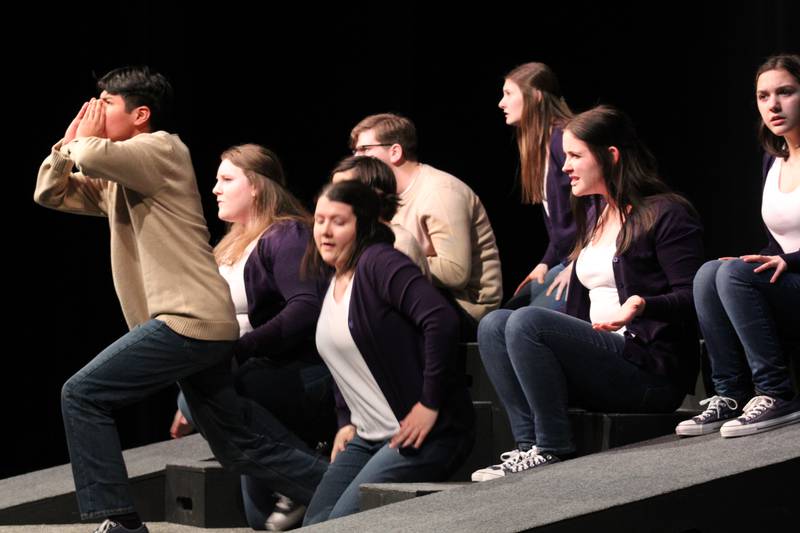 Israel Grande stands forward as the prow of a fishing ship as the remainder of the cast portrays waves breaking against the hull in the opening scene of "CODA" during a performance on Wednesday at Centennial Auditorium.