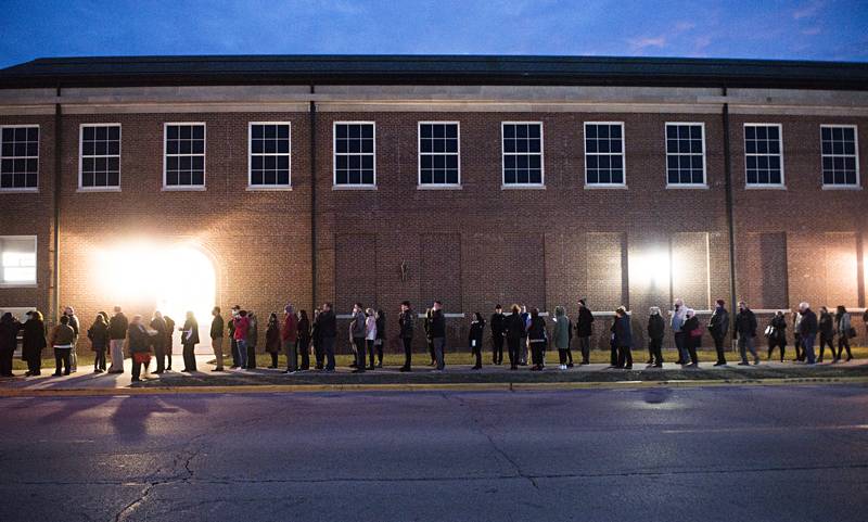 Mourners looking to pay respects to the family, line up outside of Sterling High School for the visitation of Capt. Garrett Ramos