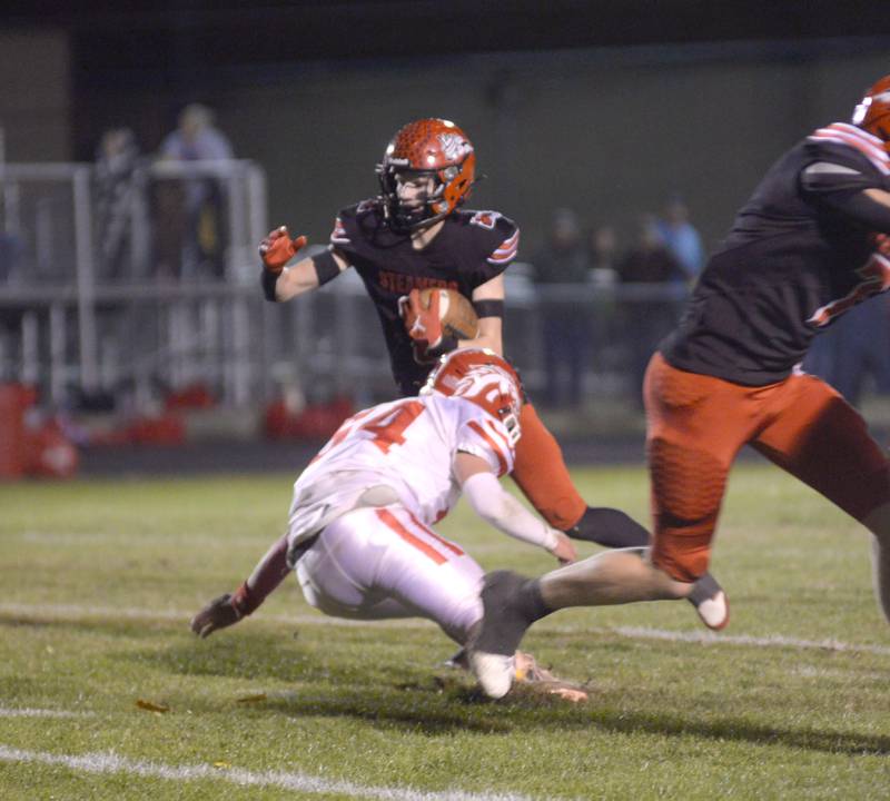 Fulton's Dane VanZuiden (2) runs for a gain against Morrison on Friday, Oct. 25, 2024 in Fulton.
