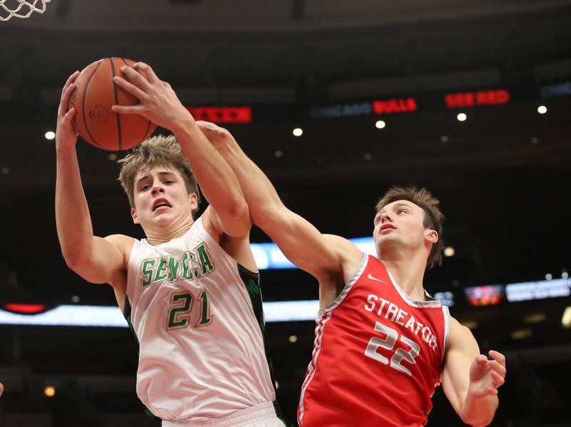 Seneca's Lane Provance grabs a rebound over Streator's Christian Benning during a game on Tuesday, Dec. 21, 2023 at the United Center in Chicago.