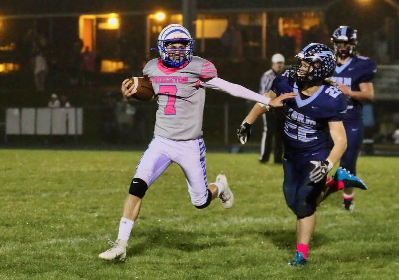 Princeton's Gavin Lanham tries to stiff arm Bureau Valley's Elijah Endress Friday night.