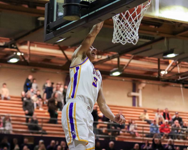 Downers Grove North's Jacob Bozeman (5) dunks during varsity basketball game between Lyons at Downers Grove North.  Jan 31, 2023.