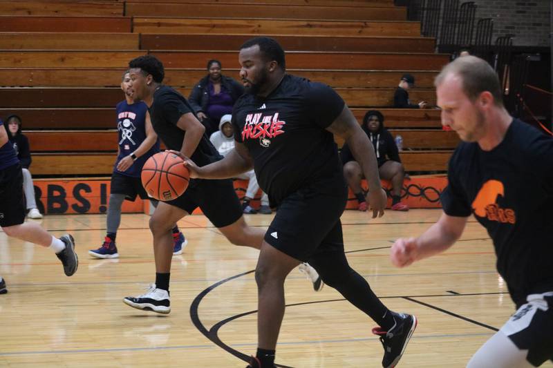 Jeff Griffin (center) charges up the floor Monday, Dec. 5, 2022 in the Toys for Tots community basketball game.