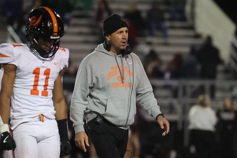 Lincoln-Way West head coach Luke Lokanc walks back to the sidelines before overtime against Lockport on Friday, Oct. 18, 2024 in Lockport.
