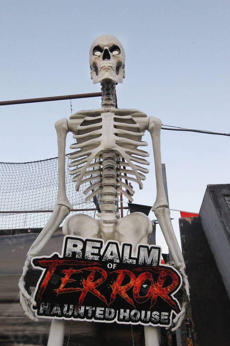 A skeleton welcomes visitors at the entrance of the Realm of Terror Haunted House in Round Lake Beach