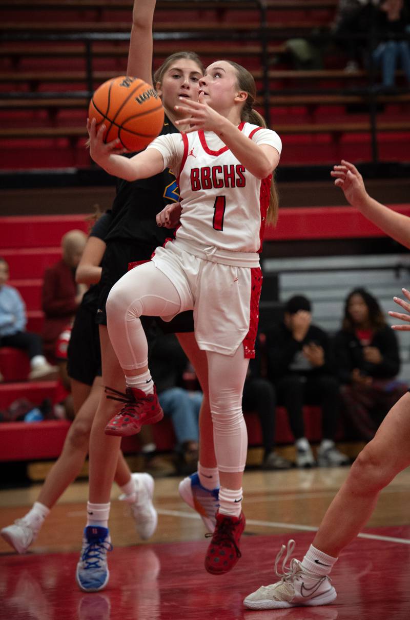 Bradley-Bourbonnais's Naturel Coday elevates for a lay-up as Sandburg's Maria Maropakis, back, defends in a game on Saturday, January 3, 2026.