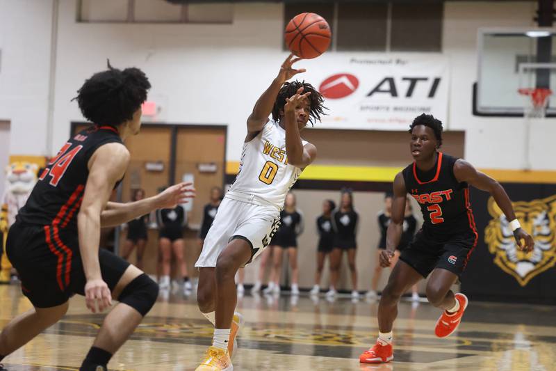 Joliet West’s Aamir Shannon passes the ball against Plainfield East on Friday, Dec. 8th, 2023 in Joliet.
