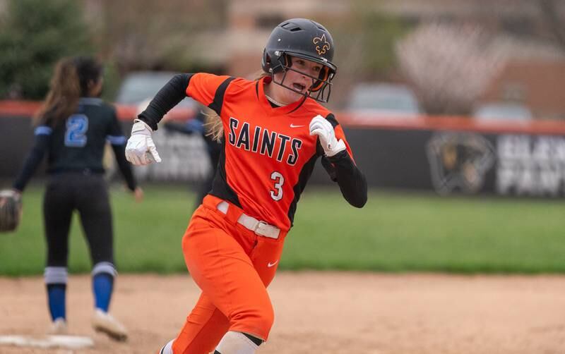 St. Charles East's Abby Arend (3) runs home for a score against St. Charles North during a softball game at St. Charles East High School on Monday, April 25, 2022.